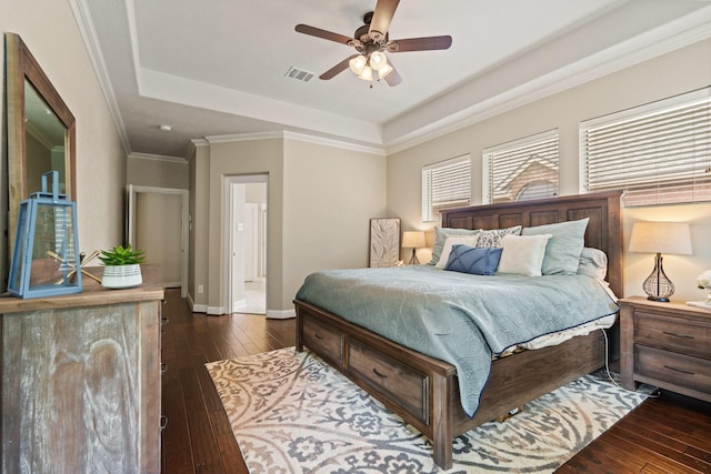 13115 Parkbrook Way Ln, Sugar Land, TX 77498 - bedroom featuring a raised ceiling, wood-type flooring, and baseboards