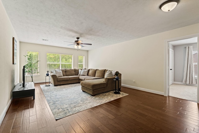 13115 Parkbrook Way Ln, Sugar Land, TX 77498 - living area with a ceiling fan, baseboards, dark wood finished floors, and a textured ceiling