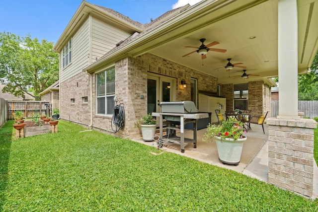 13115 Parkbrook Way Ln, Sugar Land, TX 77498 - back of property with brick siding, a patio, and ceiling fan