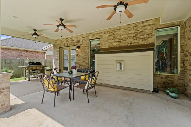 13115 Parkbrook Way Ln, Sugar Land, TX 77498 - view of patio with grilling area, outdoor dining area, a ceiling fan, and french doors