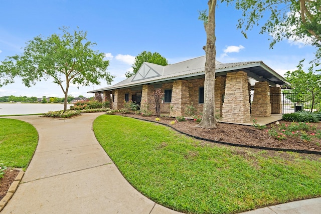 13115 Parkbrook Way Ln, Sugar Land, TX 77498 - view of front of house with stone siding and metal roof
