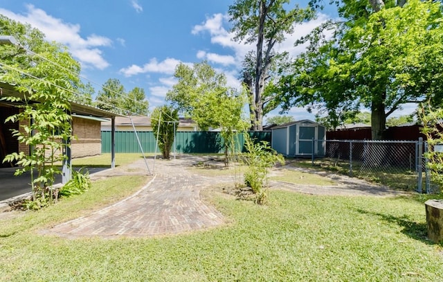view of yard with a fenced backyard, an outdoor structure, and a shed