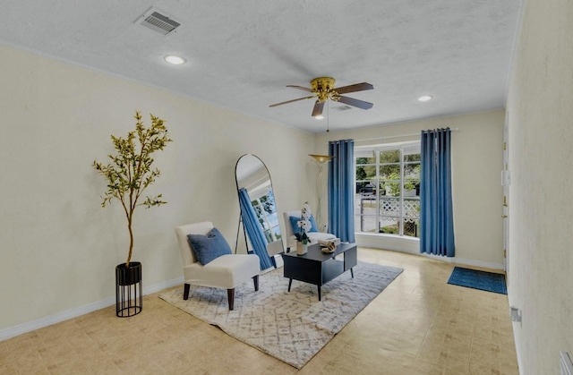 sitting room with recessed lighting, visible vents, baseboards, a textured ceiling, and ceiling fan