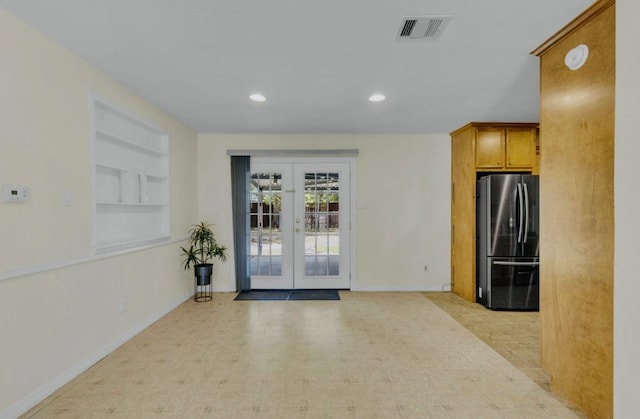 interior space with recessed lighting, visible vents, baseboards, and french doors