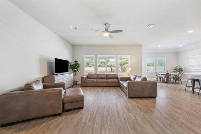 10203 Wylde Point Ln, Missouri City, TX 77459 - living room with ceiling fan, wood finished floors, recessed lighting, and baseboards
