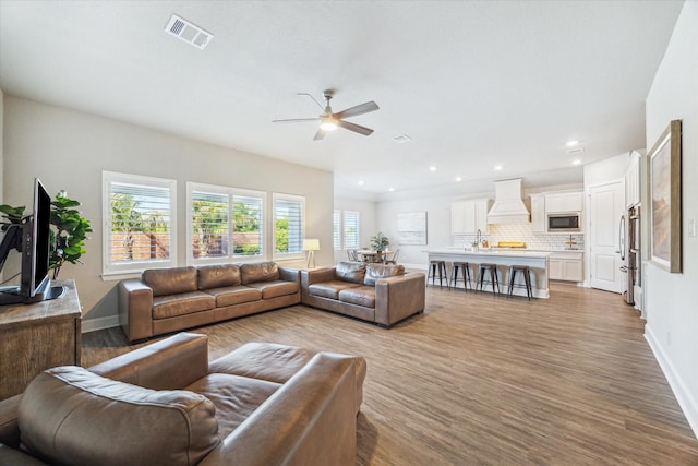 10203 Wylde Point Ln, Missouri City, TX 77459 - living room with a ceiling fan, wood finished floors, baseboards, and recessed lighting