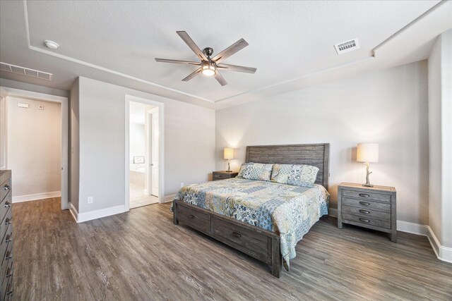 10203 Wylde Point Ln, Missouri City, TX 77459 - bedroom with baseboards, wood finished floors, ceiling fan, and connected bathroom