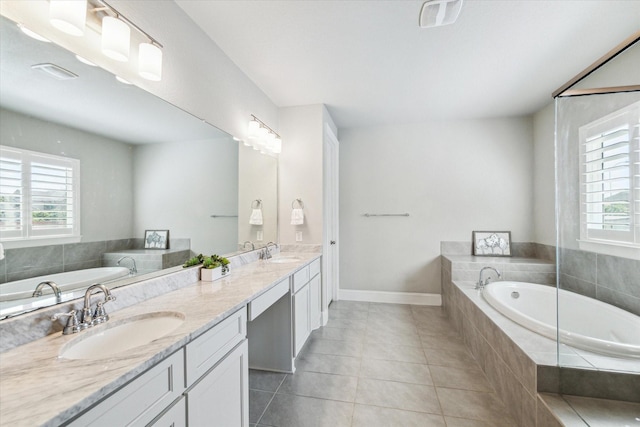 bathroom featuring plenty of natural light, a sink, and double vanity