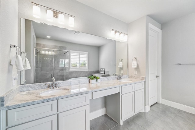 bathroom with tile patterned flooring, a sink, and a stall shower