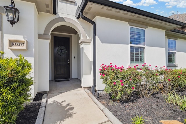 10203 Wylde Point Ln, Missouri City, TX 77459 - view of exterior entry featuring stucco siding