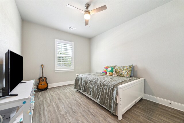 10203 Wylde Point Ln, Missouri City, TX 77459 - bedroom featuring wood finished floors, baseboards, and a ceiling fan