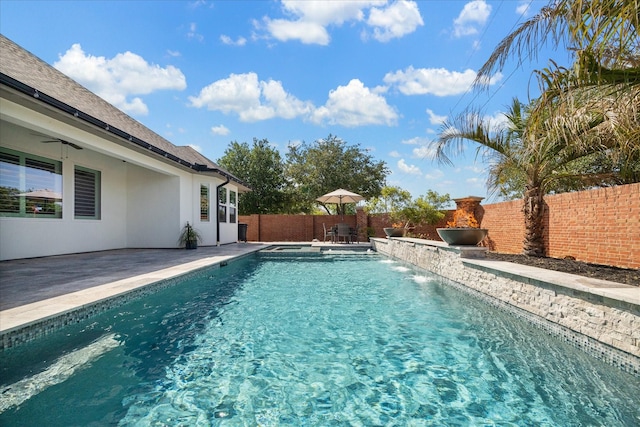 view of swimming pool with a fenced backyard, a ceiling fan, a patio, and a fenced in pool