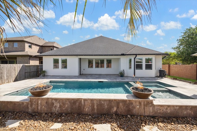 view of pool with a fenced in pool, a patio area, a fenced backyard, and an in ground hot tub