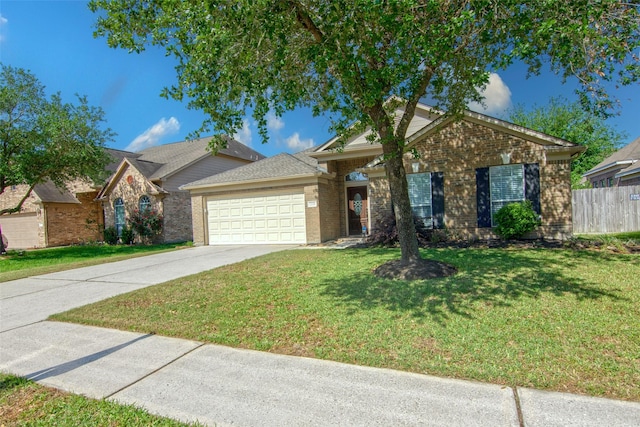ranch-style home featuring fence, concrete driveway, an attached garage, brick siding, and a front yard