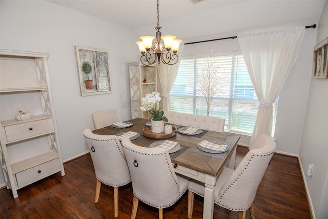 dining room with baseboards, a chandelier, and dark wood-type flooring