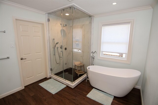 bathroom featuring ornamental molding and wood finished floors