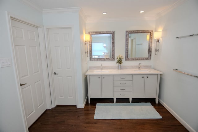 full bath with wood finished floors, baseboards, and a sink