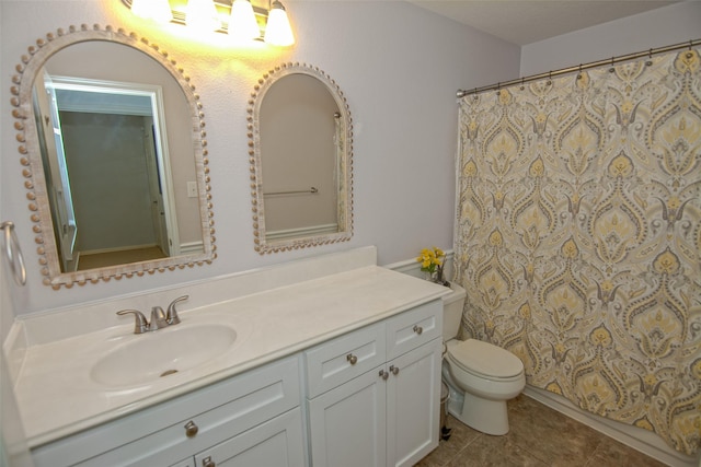bathroom featuring vanity, toilet, a shower with curtain, and tile patterned flooring