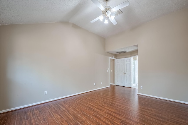 unfurnished room with ceiling fan, baseboards, wood finished floors, and visible vents