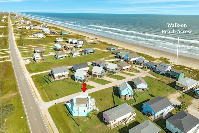 aerial view with a beach view and a water view