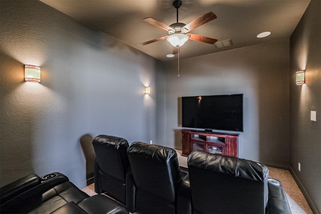 cinema room with baseboards, a ceiling fan, visible vents, and carpet floors