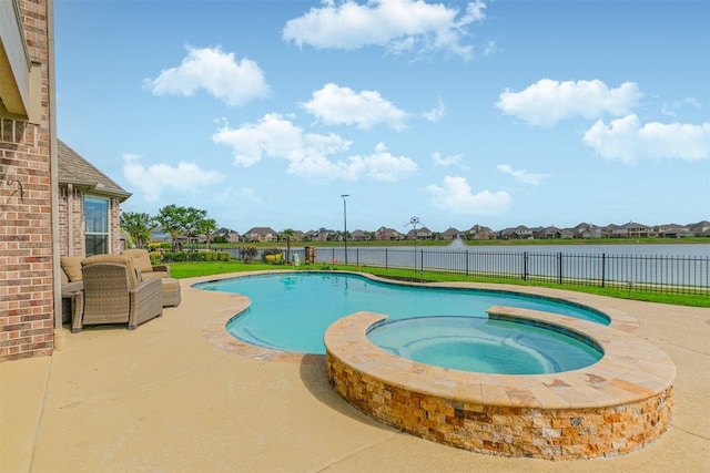 view of swimming pool with a fenced backyard, a patio area, a residential view, and a pool with connected hot tub
