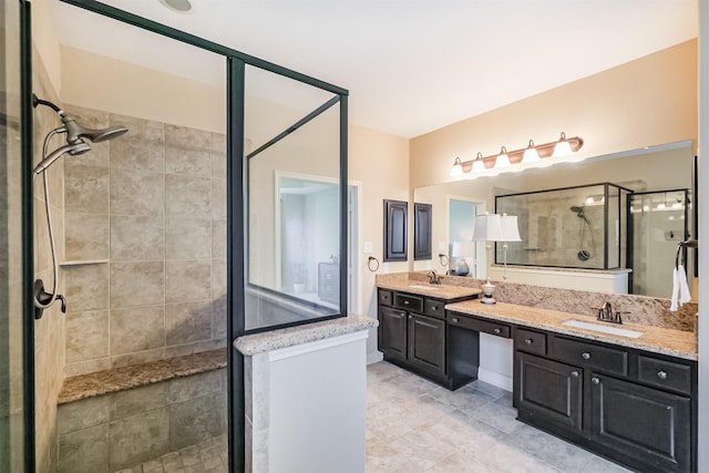 full bathroom featuring a shower stall, a sink, and double vanity