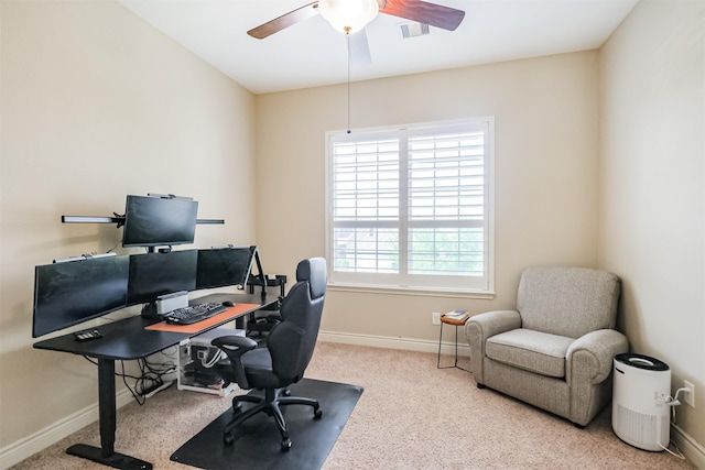 carpeted home office with visible vents, a ceiling fan, and baseboards