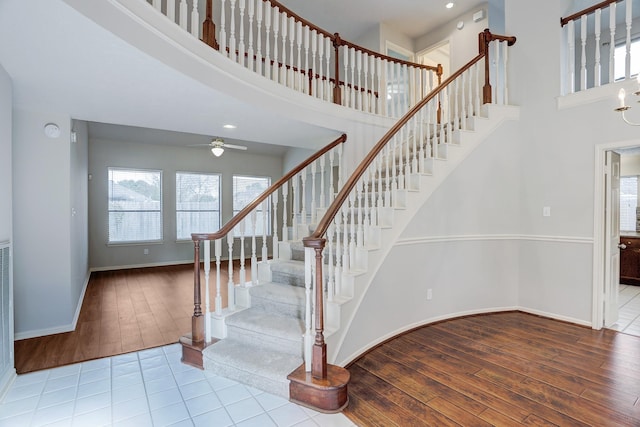 3126 Pebble Bay Dr, League City, TX 77573 - stairway with a wealth of natural light, wood finished floors, and a towering ceiling
