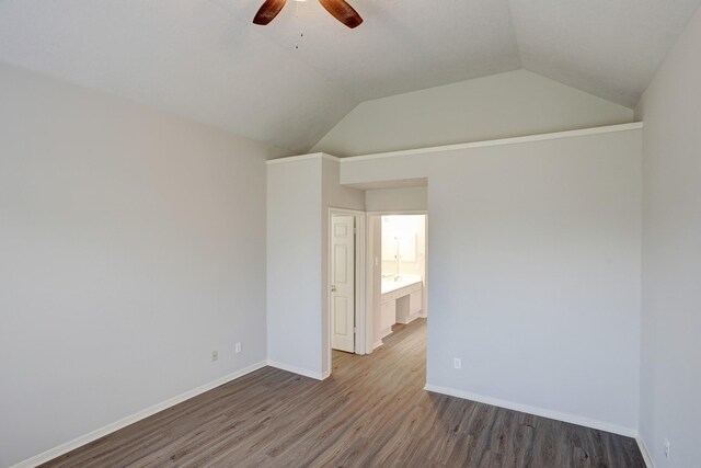 3126 Pebble Bay Dr, League City, TX 77573 - spare room featuring ceiling fan, vaulted ceiling, wood finished floors, and baseboards