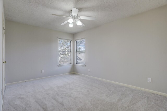 3126 Pebble Bay Dr, League City, TX 77573 - unfurnished room with a ceiling fan, baseboards, a textured ceiling, and light colored carpet