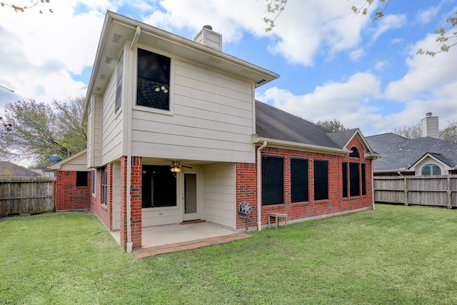 3126 Pebble Bay Dr, League City, TX 77573 - rear view of house with brick siding, a lawn, a patio, and a chimney