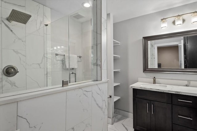 bathroom with visible vents, marble finish floor, vanity, and a marble finish shower