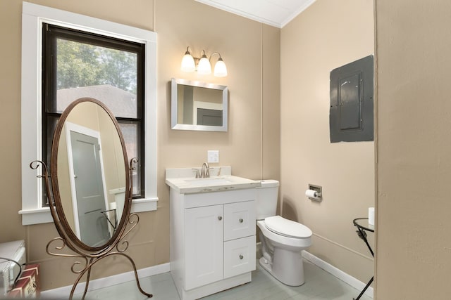 bathroom with vanity, electric panel, toilet, baseboards, and ornamental molding