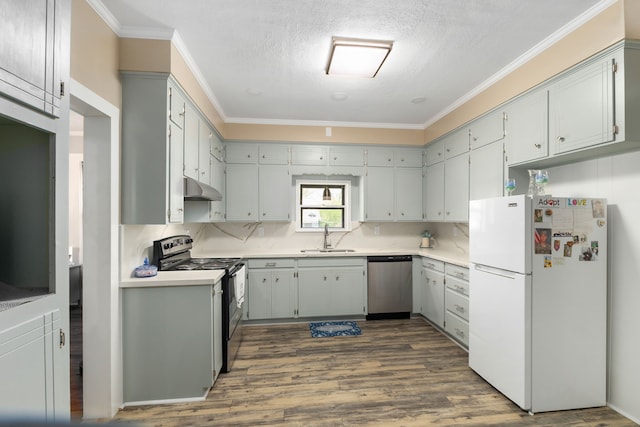 kitchen with dark wood-style floors, a sink, stainless steel dishwasher, black electric range, and freestanding refrigerator