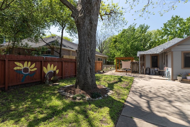 view of yard with a fenced backyard and a patio area
