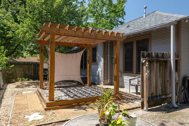 view of patio featuring fence and a pergola
