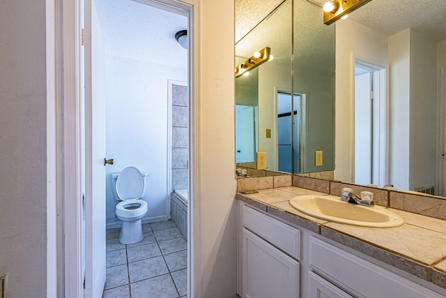 full bathroom featuring tile patterned floors, vanity, a textured ceiling, and toilet
