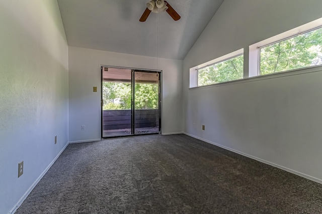 carpeted spare room with lofted ceiling, baseboards, and ceiling fan