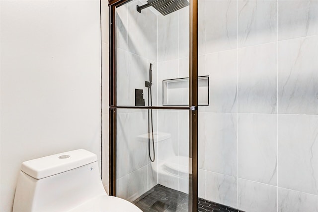 full bathroom with a stall shower and toilet