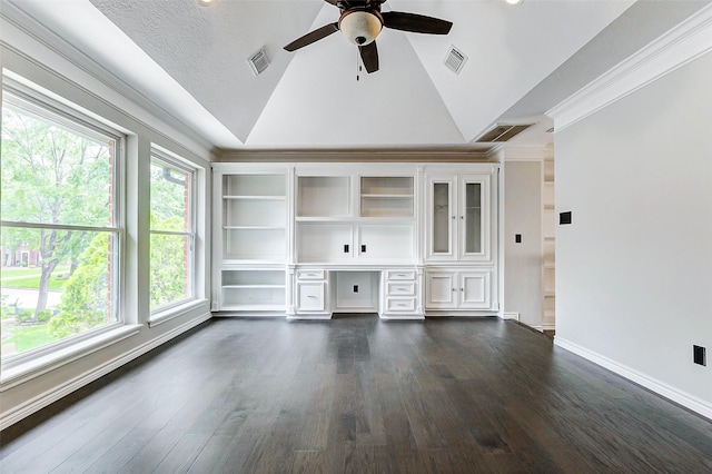unfurnished living room with lofted ceiling, ceiling fan, dark wood finished floors, ornamental molding, and baseboards
