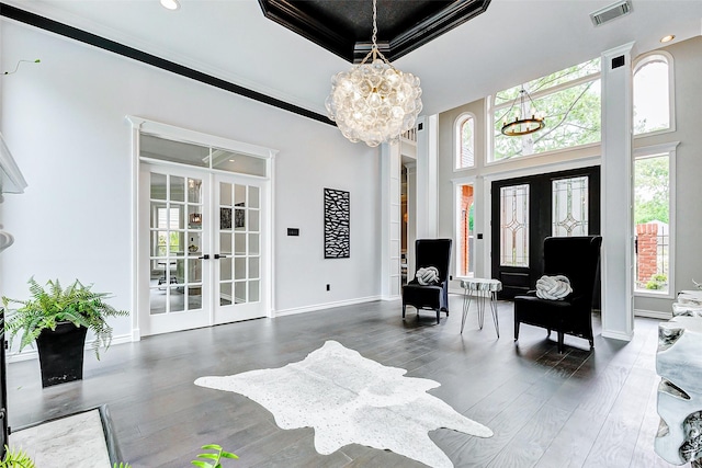 entrance foyer with french doors, a chandelier, baseboards, wood finished floors, and recessed lighting