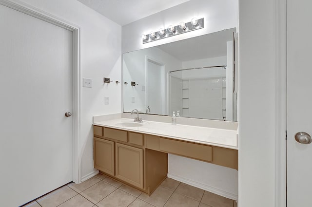 bathroom with vanity and tile patterned flooring