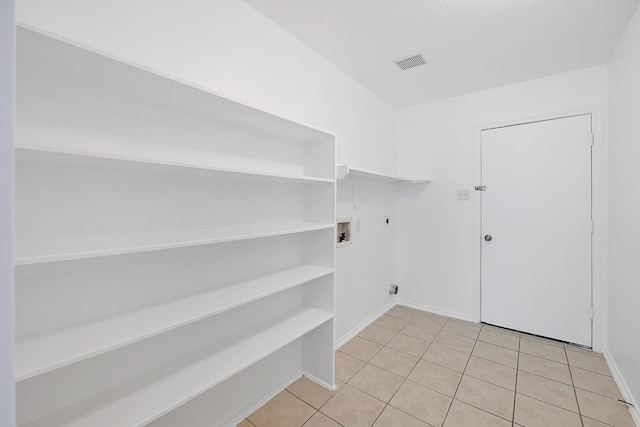 washroom with hookup for an electric dryer, visible vents, washer hookup, laundry area, and light tile patterned floors