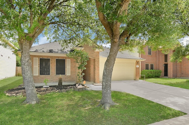 view of front of home featuring an attached garage, a front lawn, brick siding, and concrete driveway