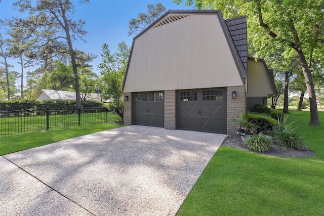 garage with fence and concrete driveway