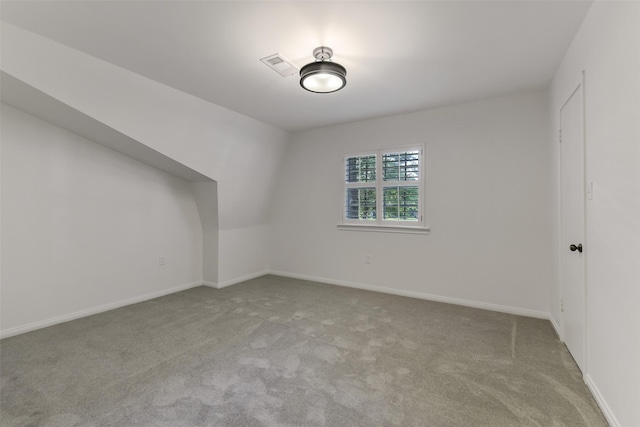 interior space with carpet floors, visible vents, and baseboards