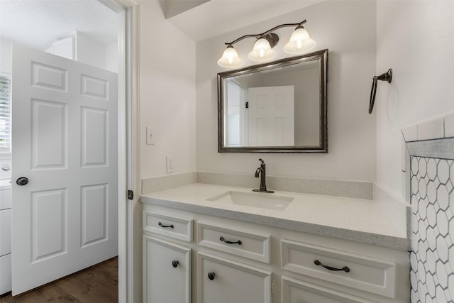 bathroom featuring vanity and wood finished floors