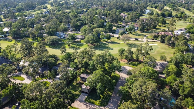 bird's eye view with view of golf course and a residential view
