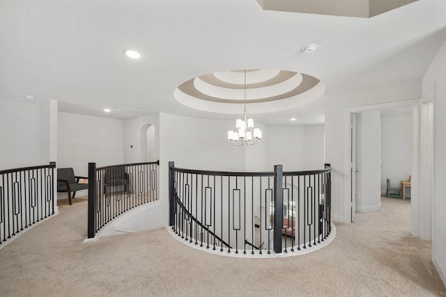 hallway featuring recessed lighting, carpet, an inviting chandelier, an upstairs landing, and baseboards